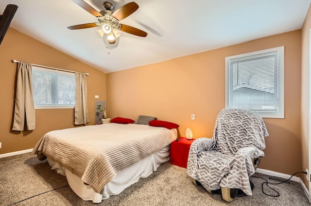 bedroom with baseboards, vaulted ceiling, a ceiling fan, and carpet flooring