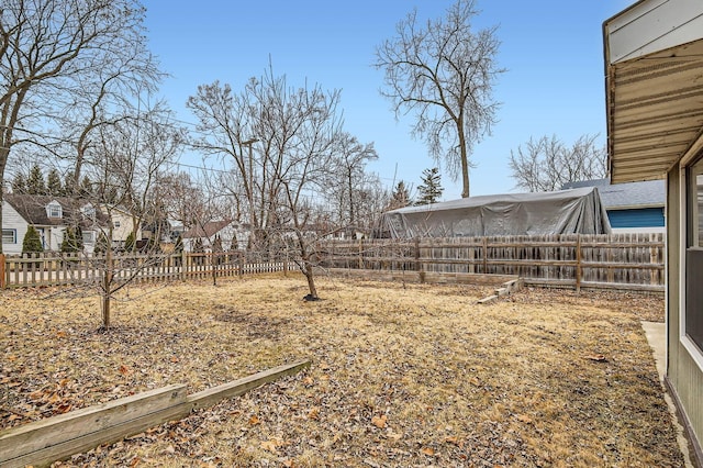 view of yard with a fenced backyard