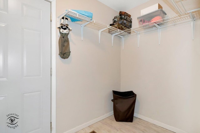 spacious closet with light wood-style floors