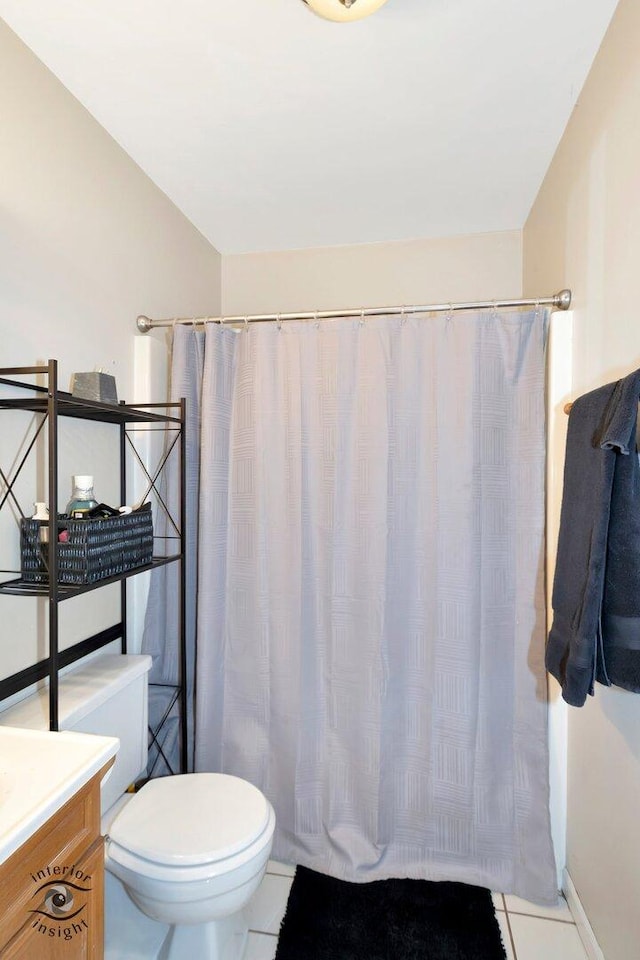 bathroom with a shower with curtain, tile patterned flooring, vanity, and toilet