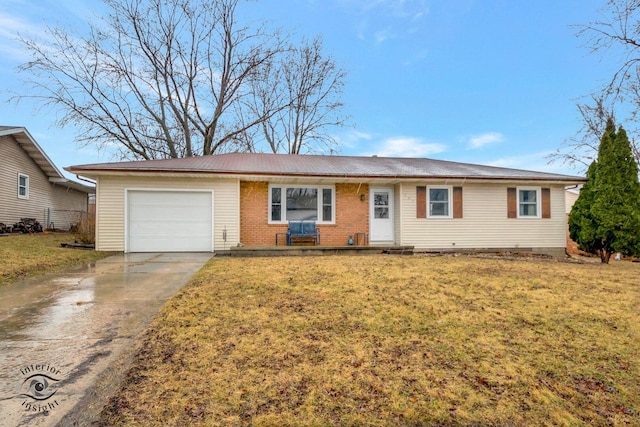 single story home featuring a garage, concrete driveway, and a front yard