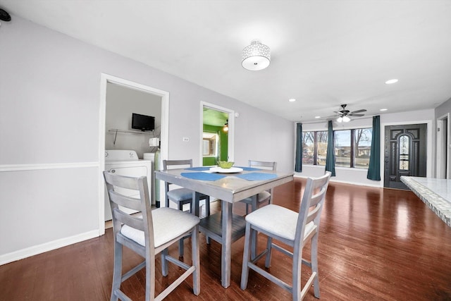 dining room featuring dark wood-style floors, recessed lighting, washing machine and dryer, and baseboards