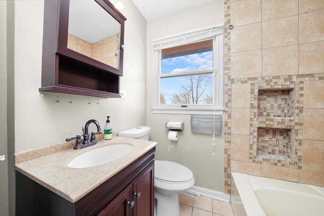 bathroom with toilet, visible vents, baseboards, vanity, and tile patterned floors