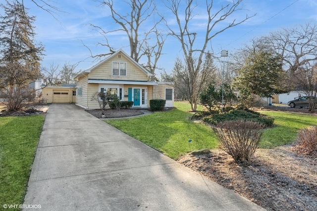 bungalow-style home with a garage, concrete driveway, and a front yard