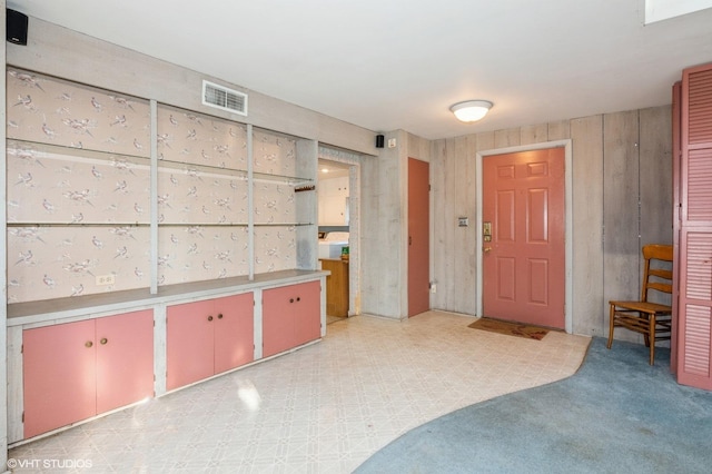 foyer featuring visible vents