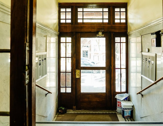 entryway featuring a wealth of natural light and mail area