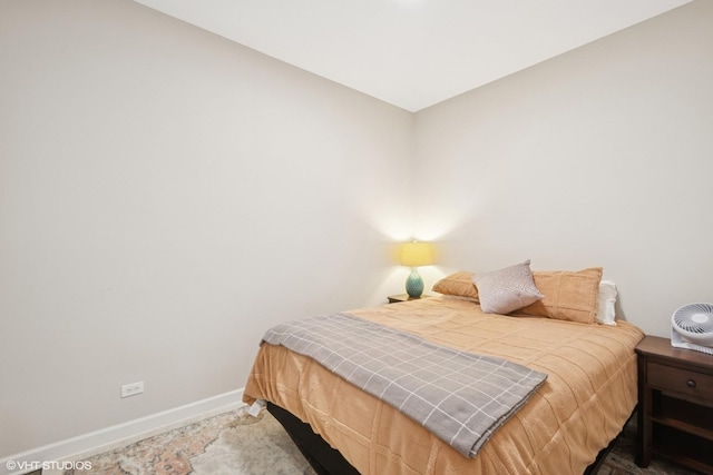 bedroom featuring baseboards