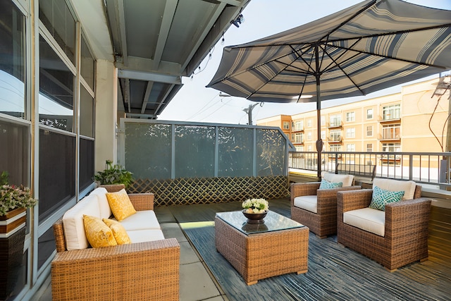 wooden deck with an outdoor living space