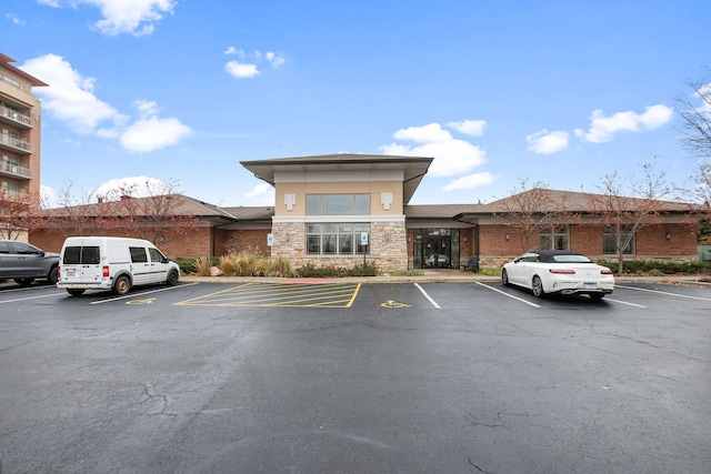 view of property featuring uncovered parking