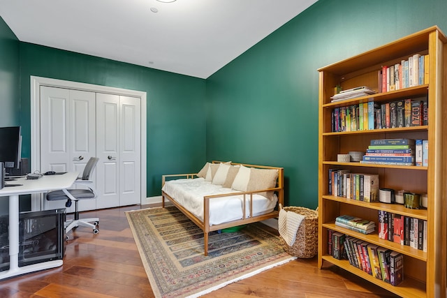 bedroom with a closet and wood finished floors