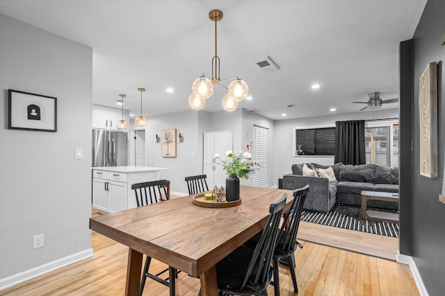 dining room featuring baseboards, visible vents, ceiling fan, light wood-type flooring, and recessed lighting