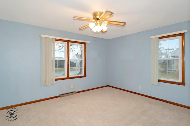 carpeted empty room with ceiling fan, baseboards, and baseboard heating