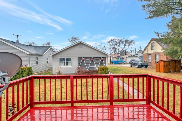 deck with a residential view and a lawn