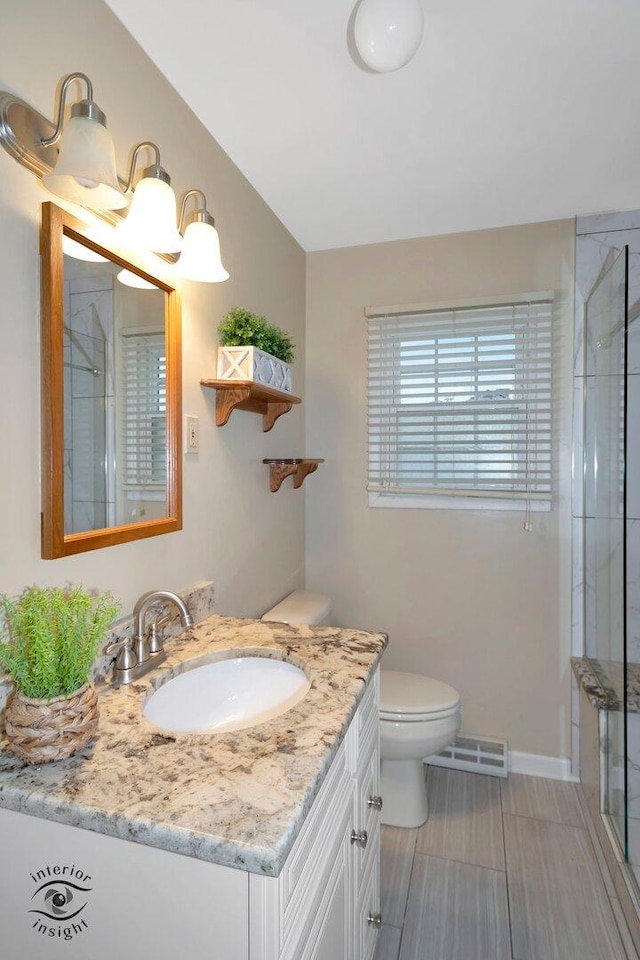 full bathroom featuring visible vents, toilet, lofted ceiling, a shower with shower door, and vanity