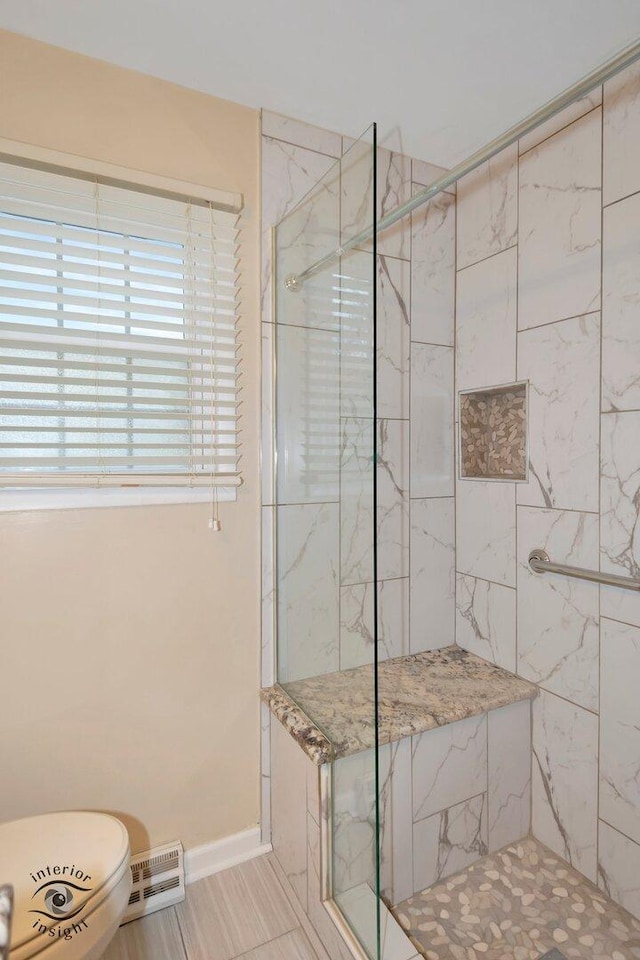 bathroom featuring a walk in shower, toilet, visible vents, and baseboards