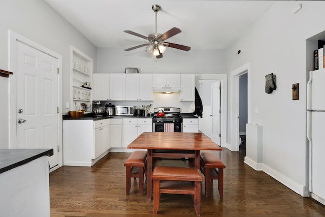 kitchen with white appliances, dark countertops, dark wood-type flooring, and under cabinet range hood