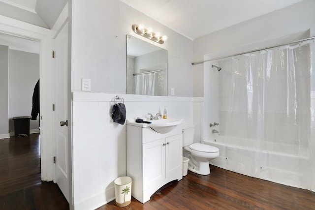 full bath featuring toilet, wood finished floors, a wainscoted wall, and shower / tub combo with curtain