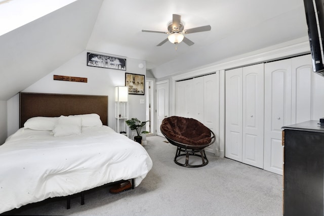 bedroom featuring a closet, ceiling fan, carpet flooring, and vaulted ceiling