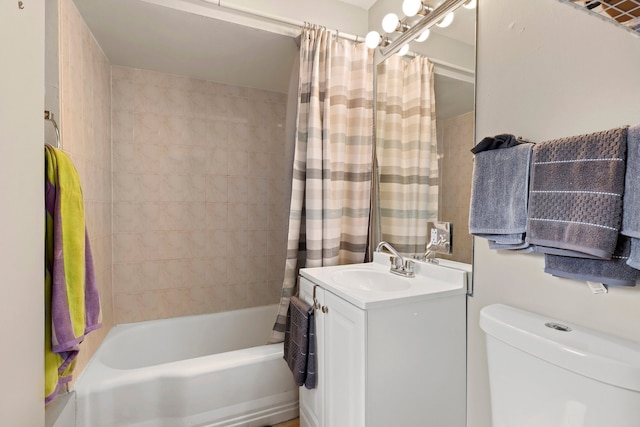 bathroom with shower / bath combo with shower curtain, toilet, and vanity