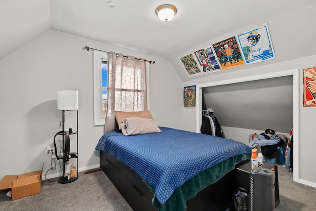 carpeted bedroom featuring baseboards and lofted ceiling