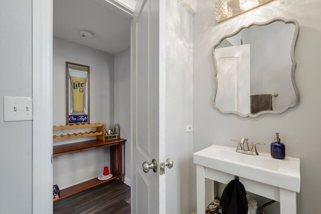 bathroom featuring baseboards and wood finished floors