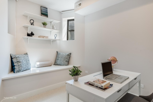 carpeted office featuring baseboards and visible vents