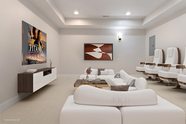 carpeted living room with recessed lighting, electric panel, and baseboards