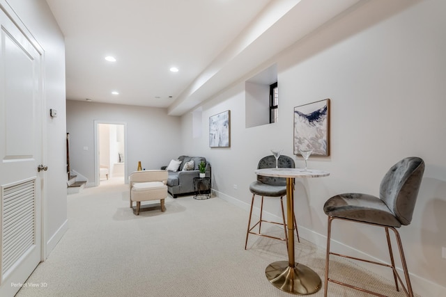 sitting room featuring recessed lighting, visible vents, carpet flooring, baseboards, and stairs