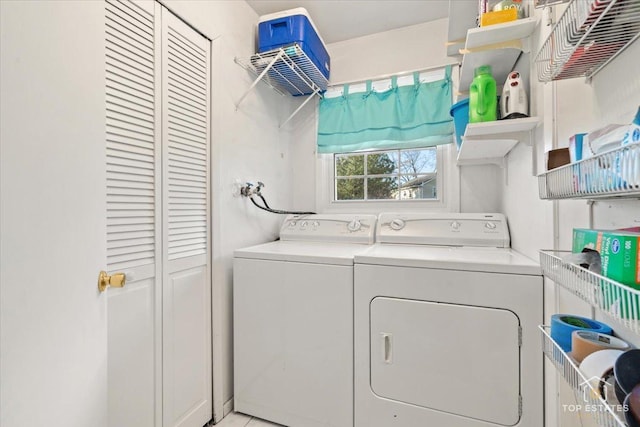 clothes washing area with washer and dryer and laundry area