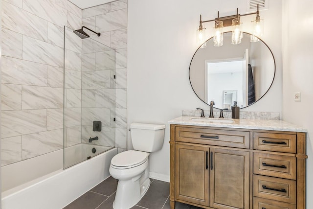 bathroom featuring toilet, washtub / shower combination, vanity, baseboards, and tile patterned floors