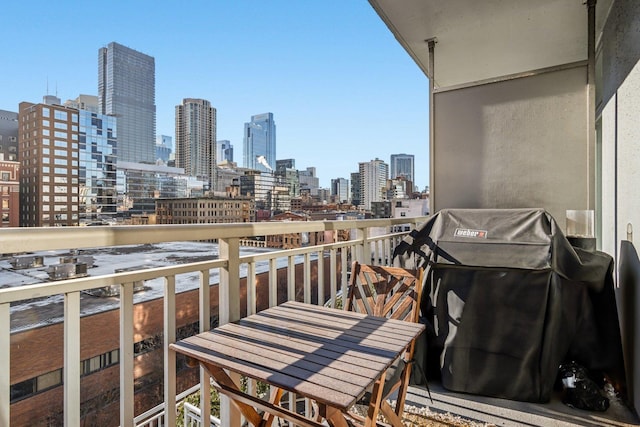 balcony with a view of city and a grill