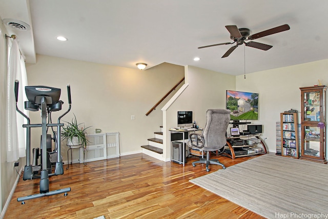 home office with recessed lighting, wood finished floors, a ceiling fan, visible vents, and baseboards