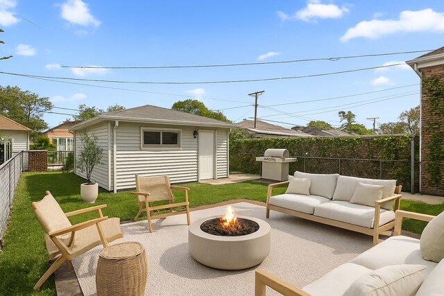 8837 S Throop St, Chicago, IL 60620 - view of patio with area for grilling, an outdoor living space with a fire pit, and an outdoor structure