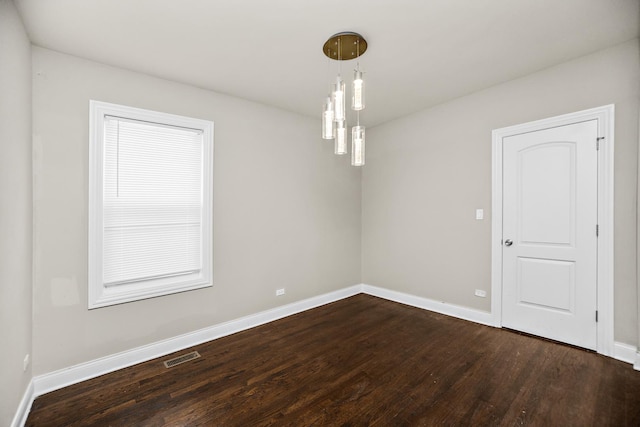 8837 S Throop St, Chicago, IL 60620 - empty room featuring dark wood-style floors and baseboards