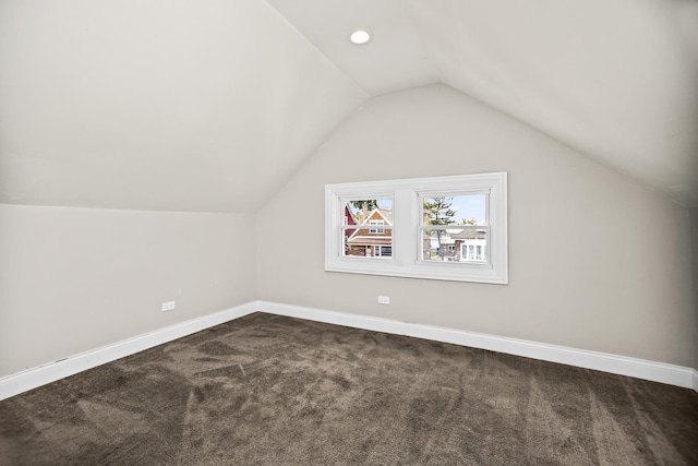 8837 S Throop St, Chicago, IL 60620 - additional living space with dark colored carpet, lofted ceiling, and baseboards