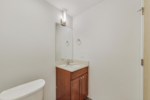 half bath with vanity and toilet