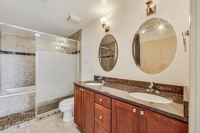 full bath featuring double vanity, tile patterned flooring, a sink, and tiled shower