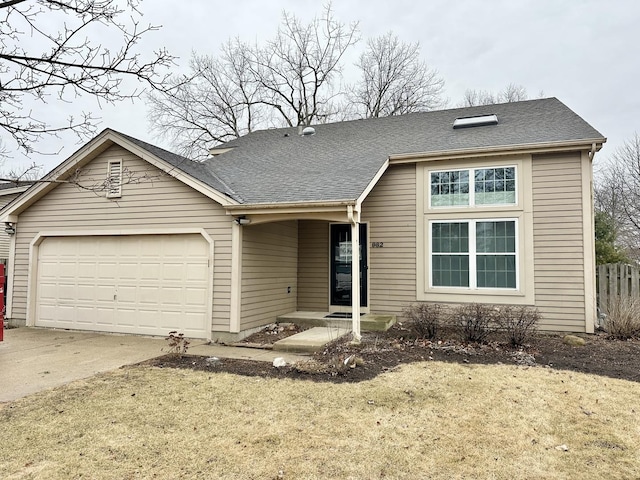 ranch-style home featuring an attached garage, concrete driveway, and roof with shingles