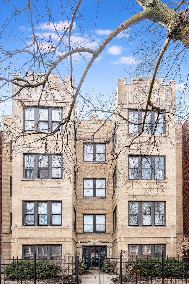 view of property featuring a fenced front yard