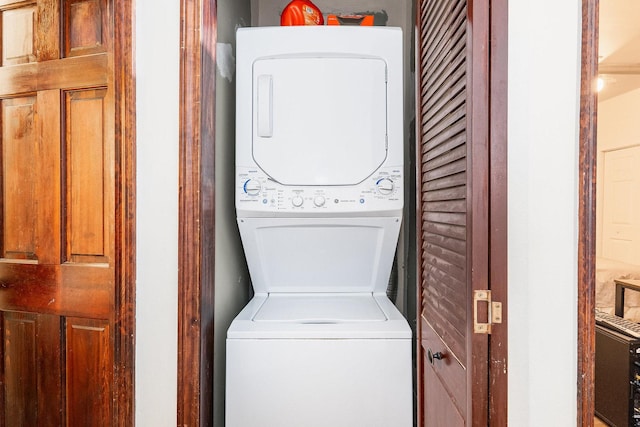 washroom with laundry area and stacked washer and clothes dryer