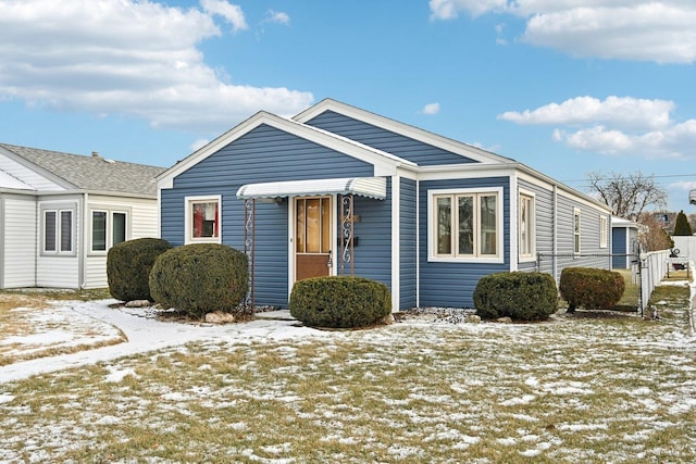 view of front of home featuring fence