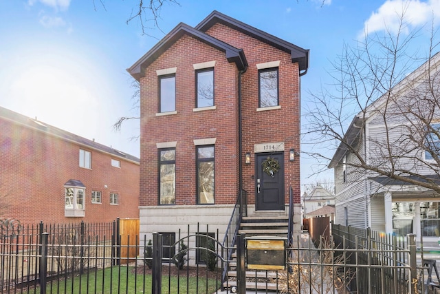 view of front facade featuring entry steps, central AC, brick siding, and a fenced front yard