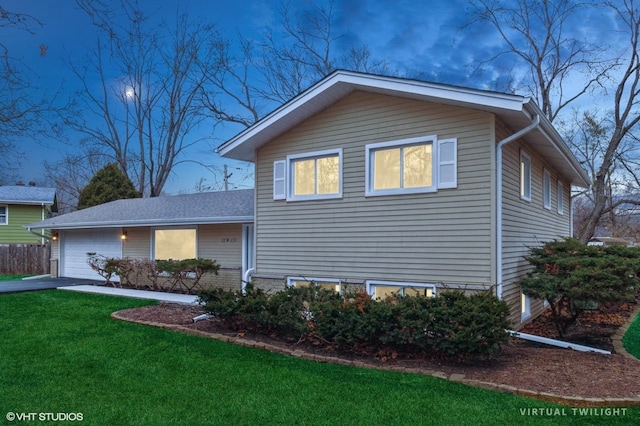 view of front of property with a garage, driveway, brick siding, and a front yard