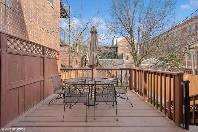 wooden terrace with outdoor dining area