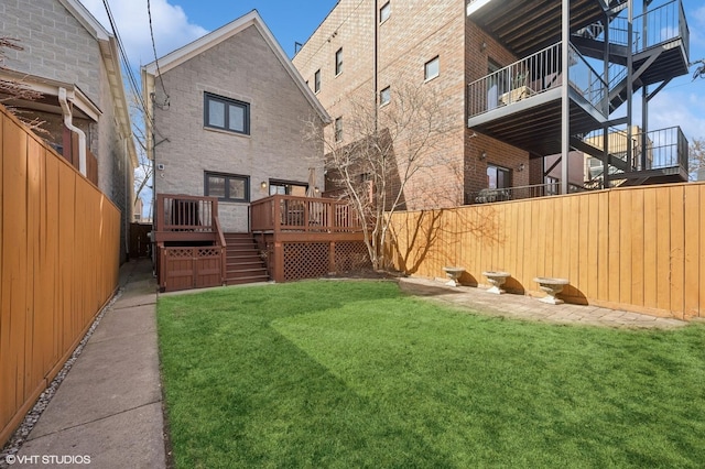 view of yard featuring a deck and a fenced backyard