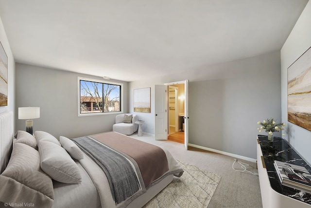 bedroom with baseboards and light carpet