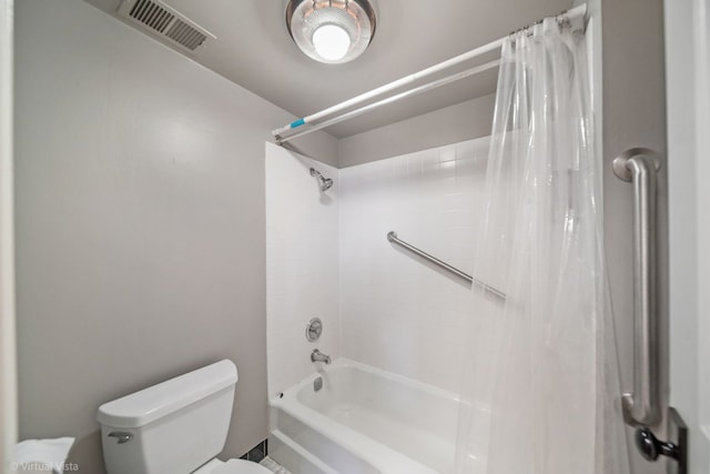 bathroom with visible vents, toilet, and shower / bath combo with shower curtain