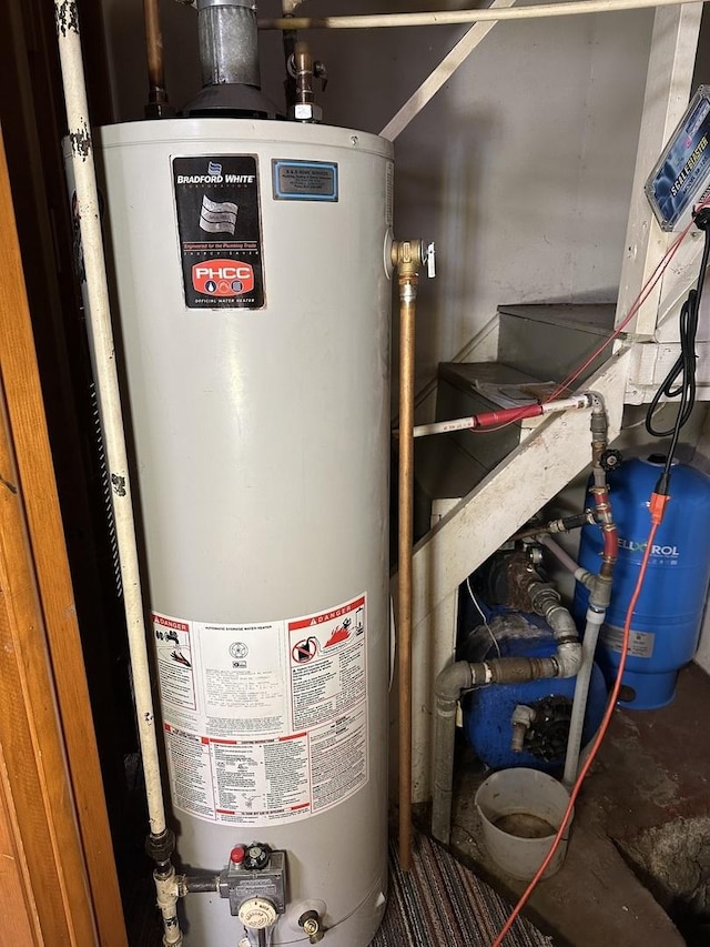 utility room featuring gas water heater