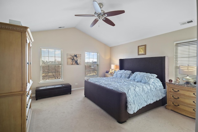 bedroom with ceiling fan, visible vents, vaulted ceiling, and light colored carpet