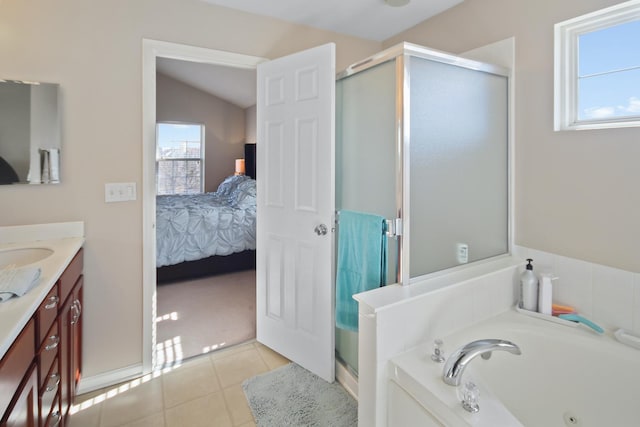 ensuite bathroom featuring a jetted tub, a stall shower, ensuite bath, and tile patterned floors